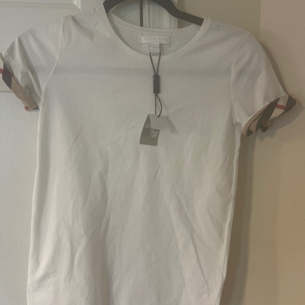 NWT Burberry tags  Burberry size 12 shirt fits like XS women’s.